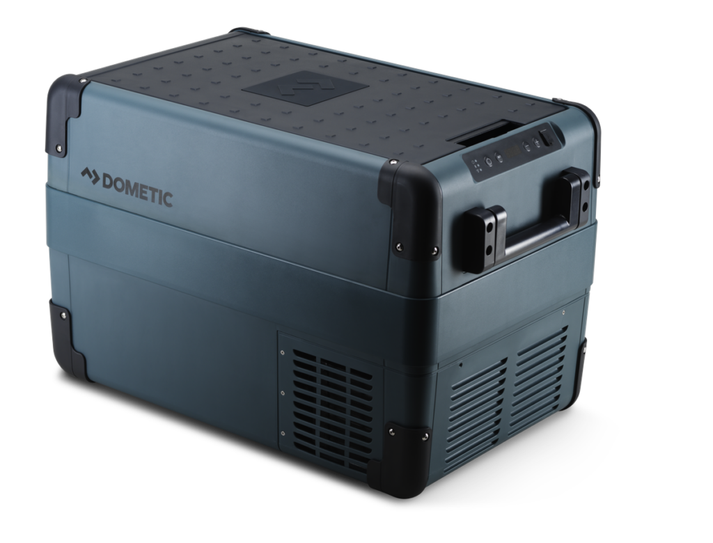 Dometic portable cooler with digital controls and sturdy handle for outdoor activities.